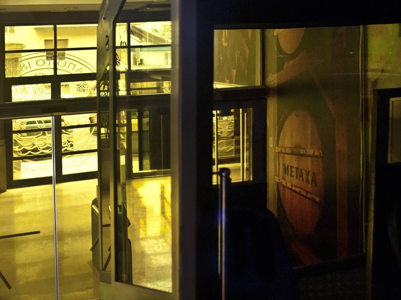 Lycabettus Hill funicular, Athens — station entrance at night, AKPRAXIS renovation