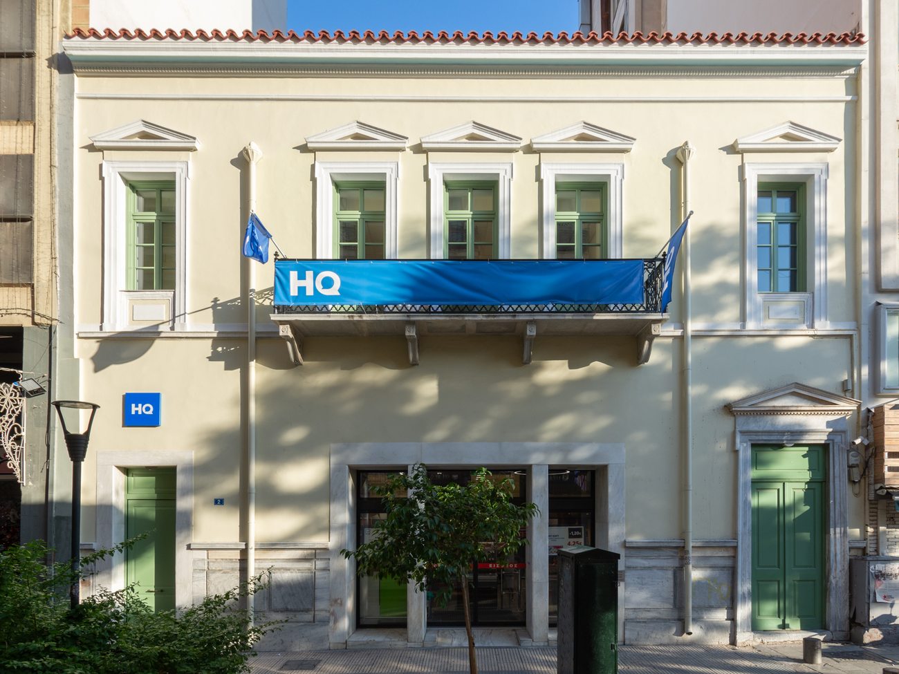 HQ Omonia offices, Athens — restored neoclassical facade in afternoon light, AKPRAXIS renovation and office fit-out